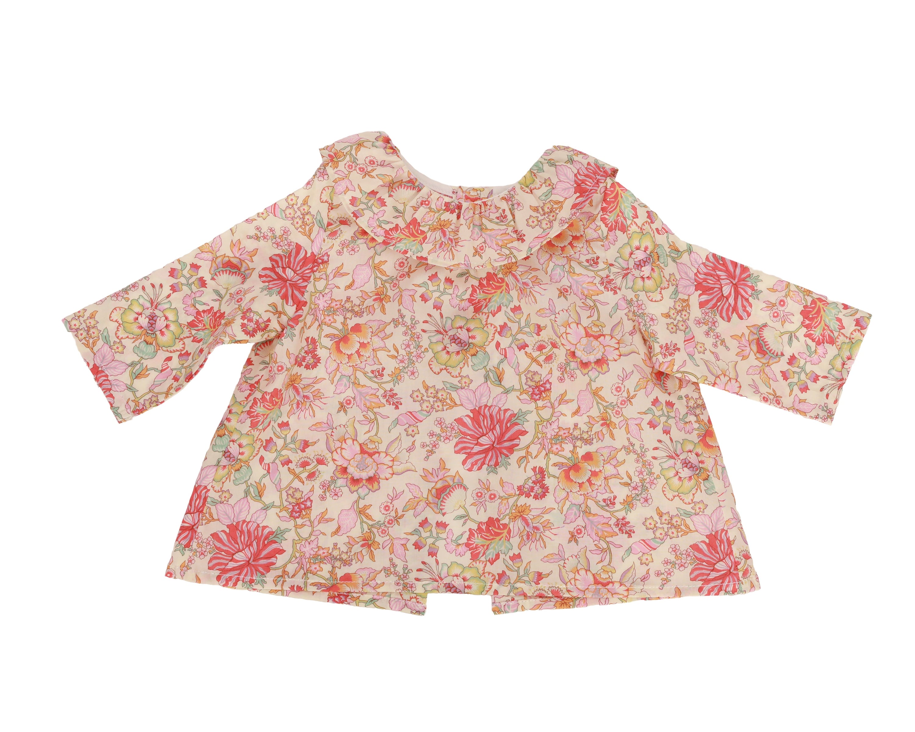 Floral patterned baby blouse on a white background
